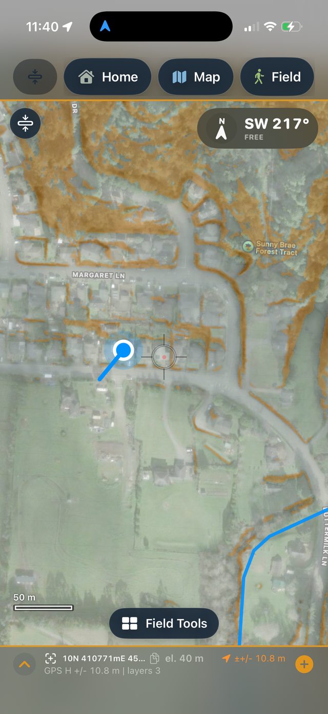 Ology map screen with lidar terrain, compass bearing, and the Field Tools panel open